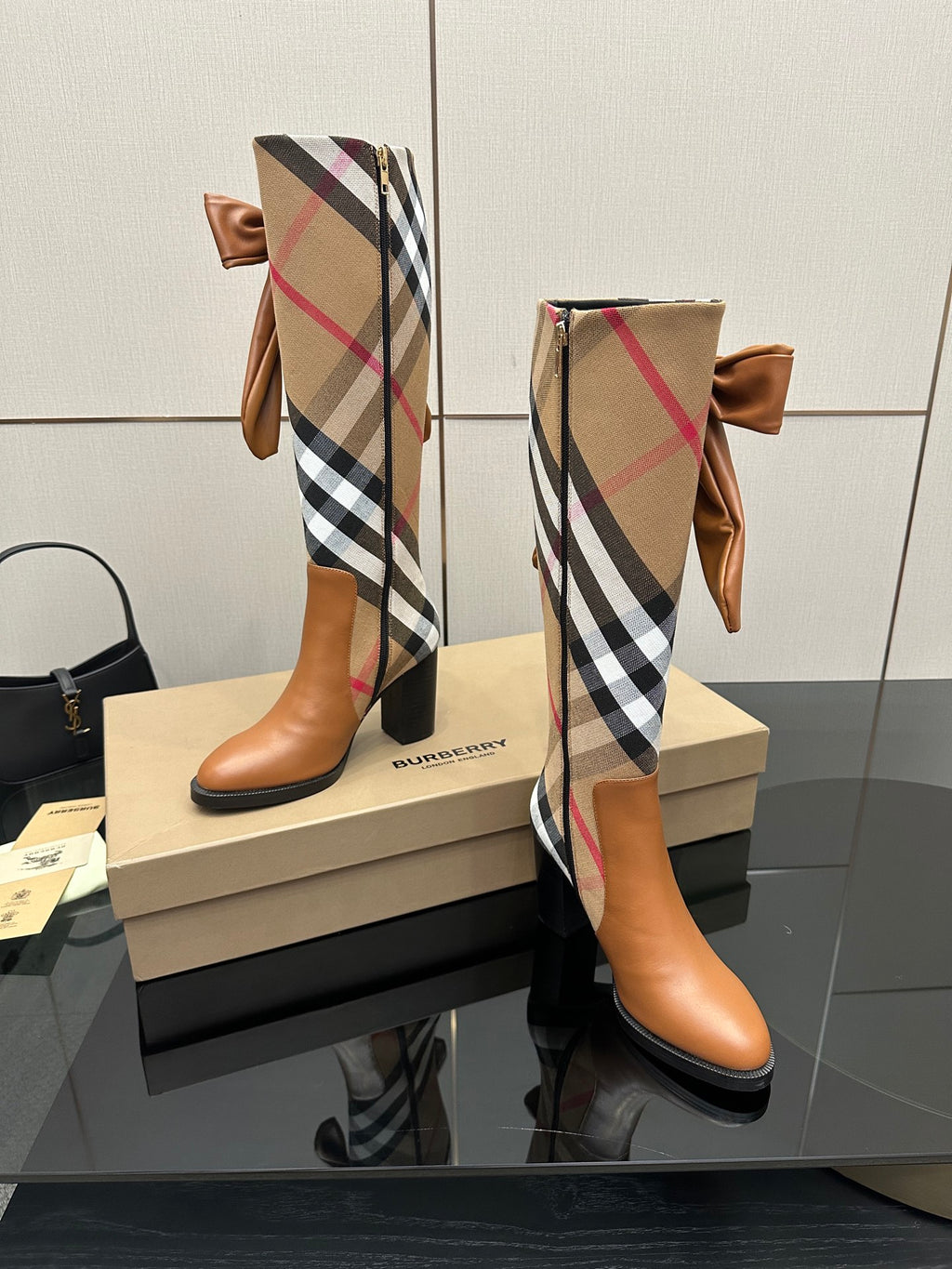 Burberry check ankle boots with tan leather, bow ties at the shaft, side profile
