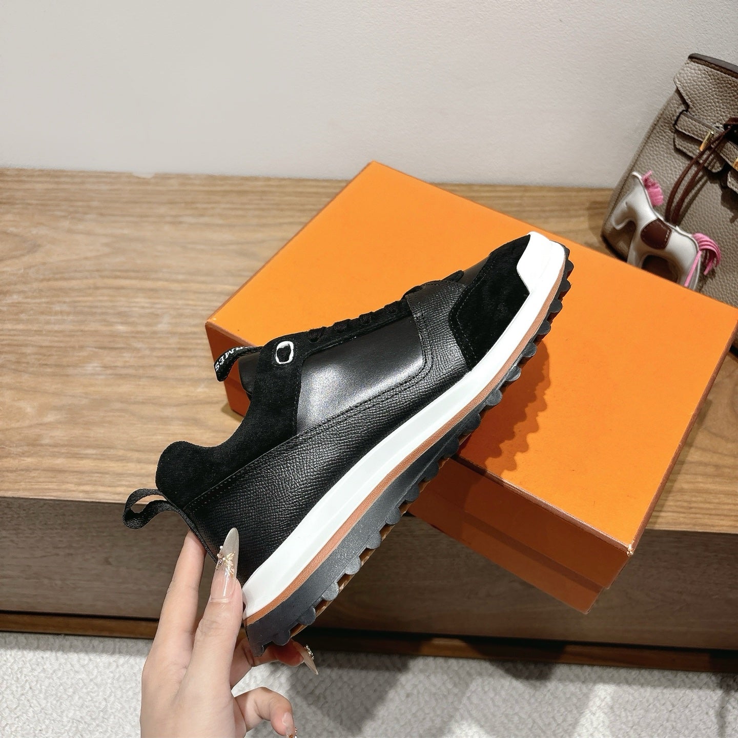 Hermes unisex sneakers in black with lace-up, white sidewall and rubber sole