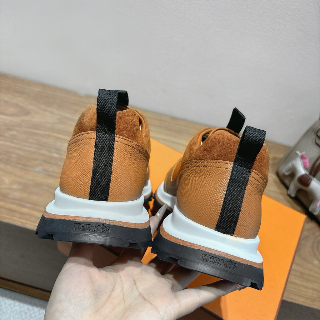 Hermes unisex sneakers brown with black heel straps, close-up of back view pair