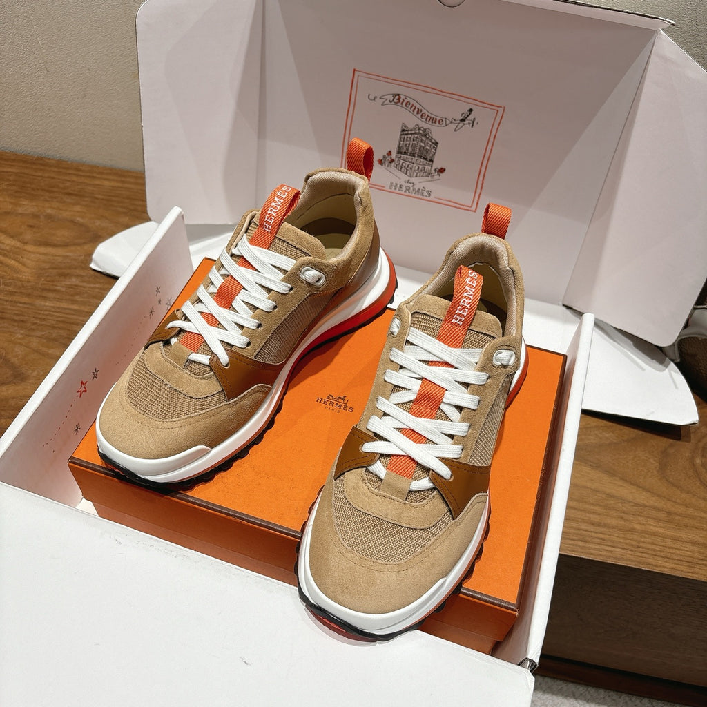 Hermes unisex sneakers in open box: beige uppers, white laces, orange heel tabs