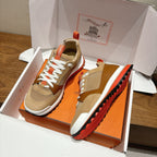 Hermes unisex sneakers in box with side profile, beige uppers and red-orange sole details
