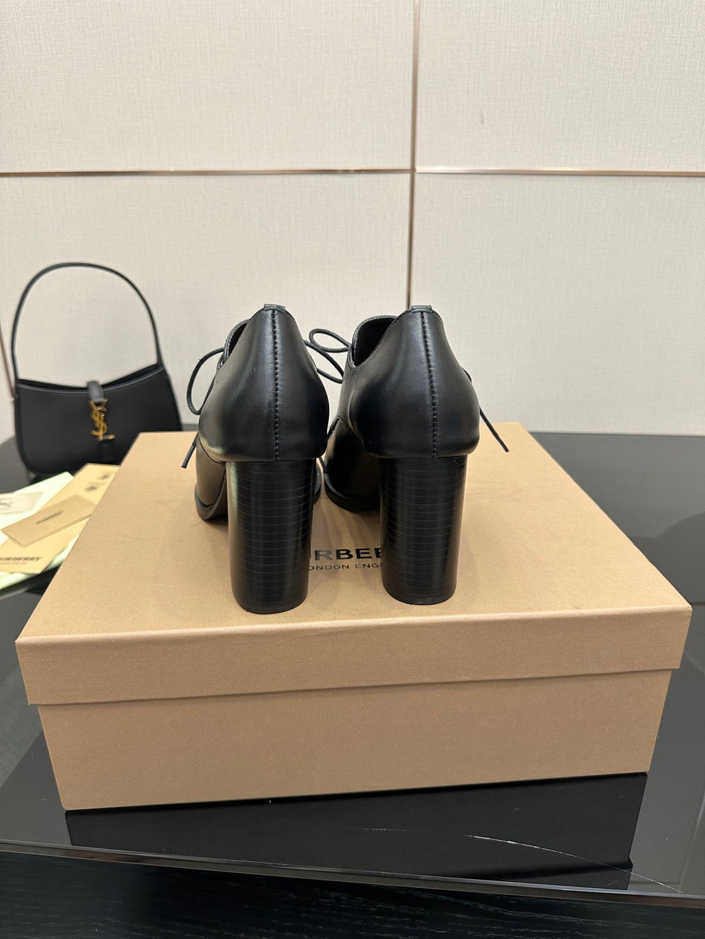 Back view of black lace-up ankle boots with block heels
