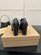 Back view of black lace-up ankle boots with block heels