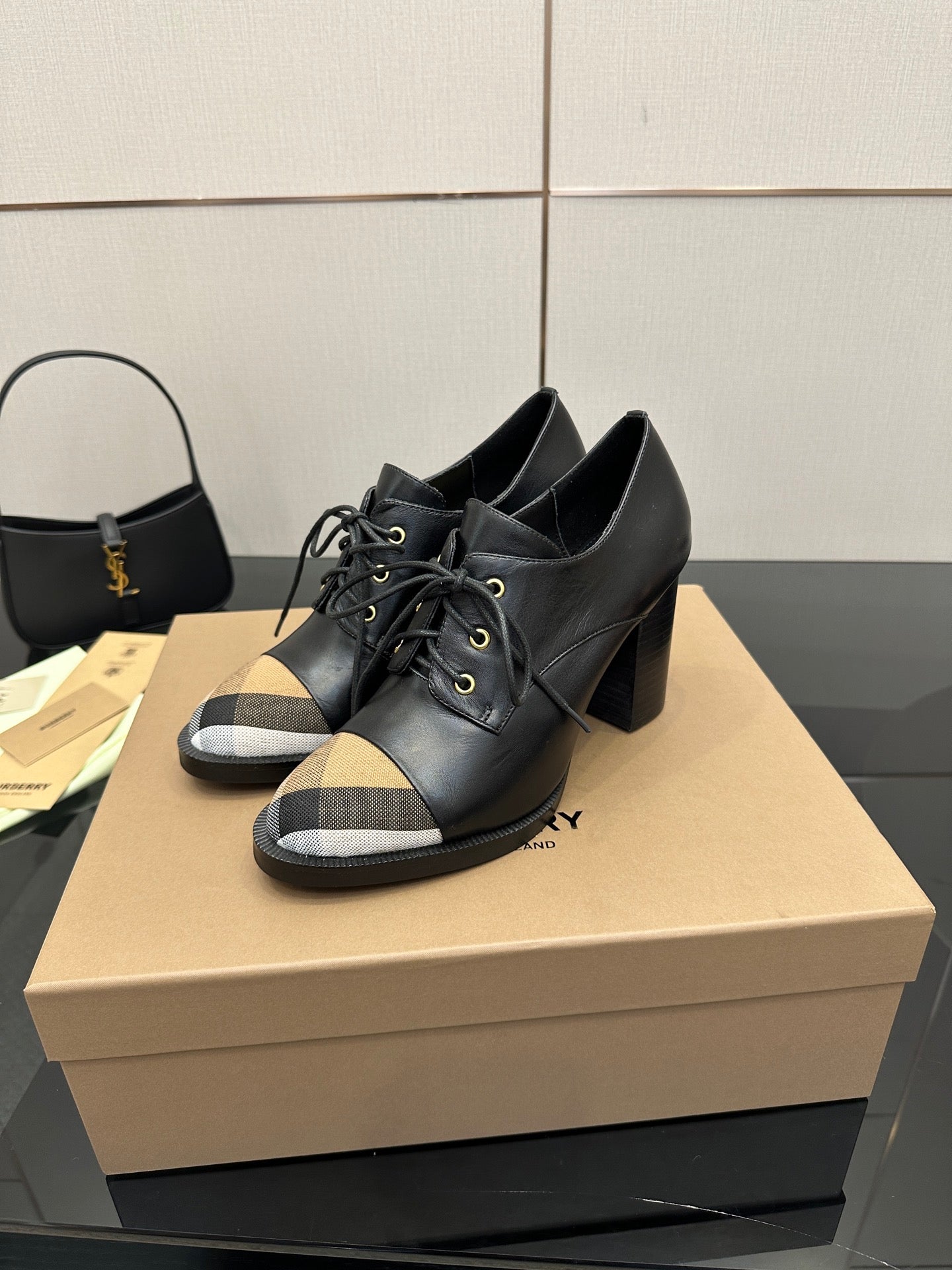 Black lace-up ankle boots with block heel and beige check toe panels