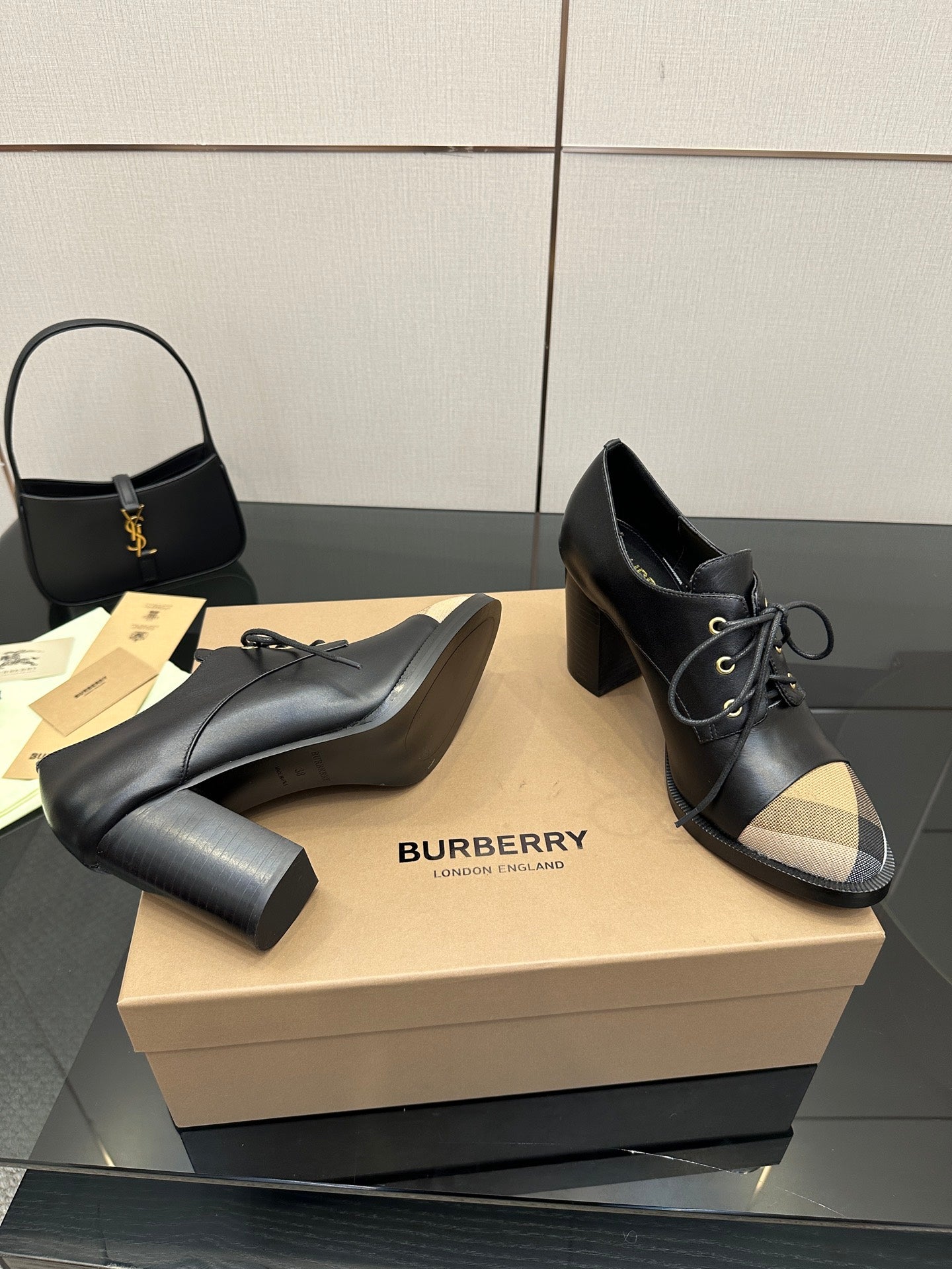 Black leather lace-up ankle boots with block heel and beige check toe panels