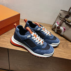 Hermes unisex sneakers, navy blue with white laces, orange heel tab and red outsole edge