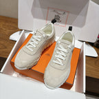 Pair of Hermes unisex sneakers, light beige uppers with lace-up front and cushioned sole