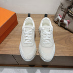 Hermes unisex sneakers in light beige with white laces and textured rubber sole