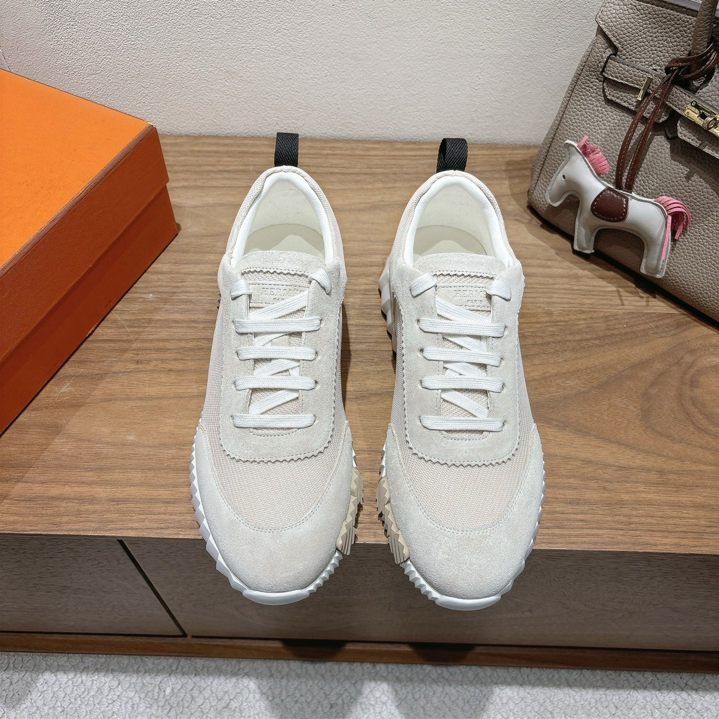 Hermes unisex sneakers in light beige with white laces and textured rubber sole