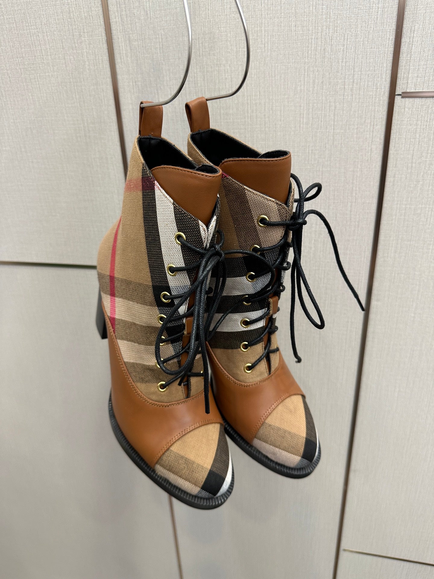 Tan Burberry check lace-up ankle boots, front view, with black laces