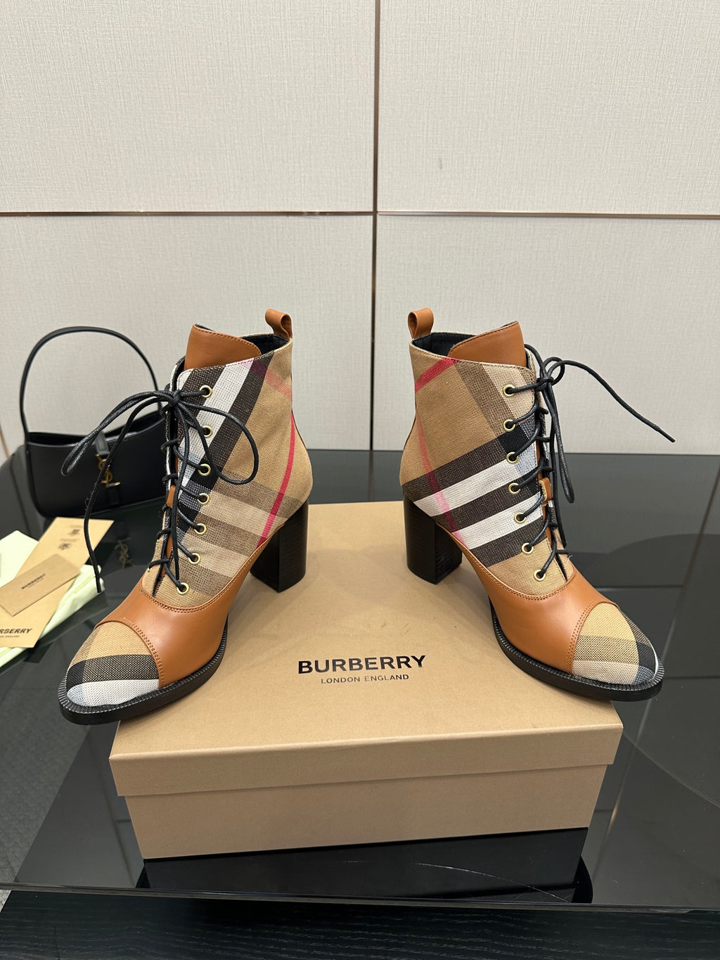 Pair of tan check lace-up ankle boots with black laces and block heel