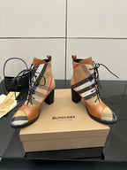 Pair of tan check lace-up ankle boots with black laces and block heel