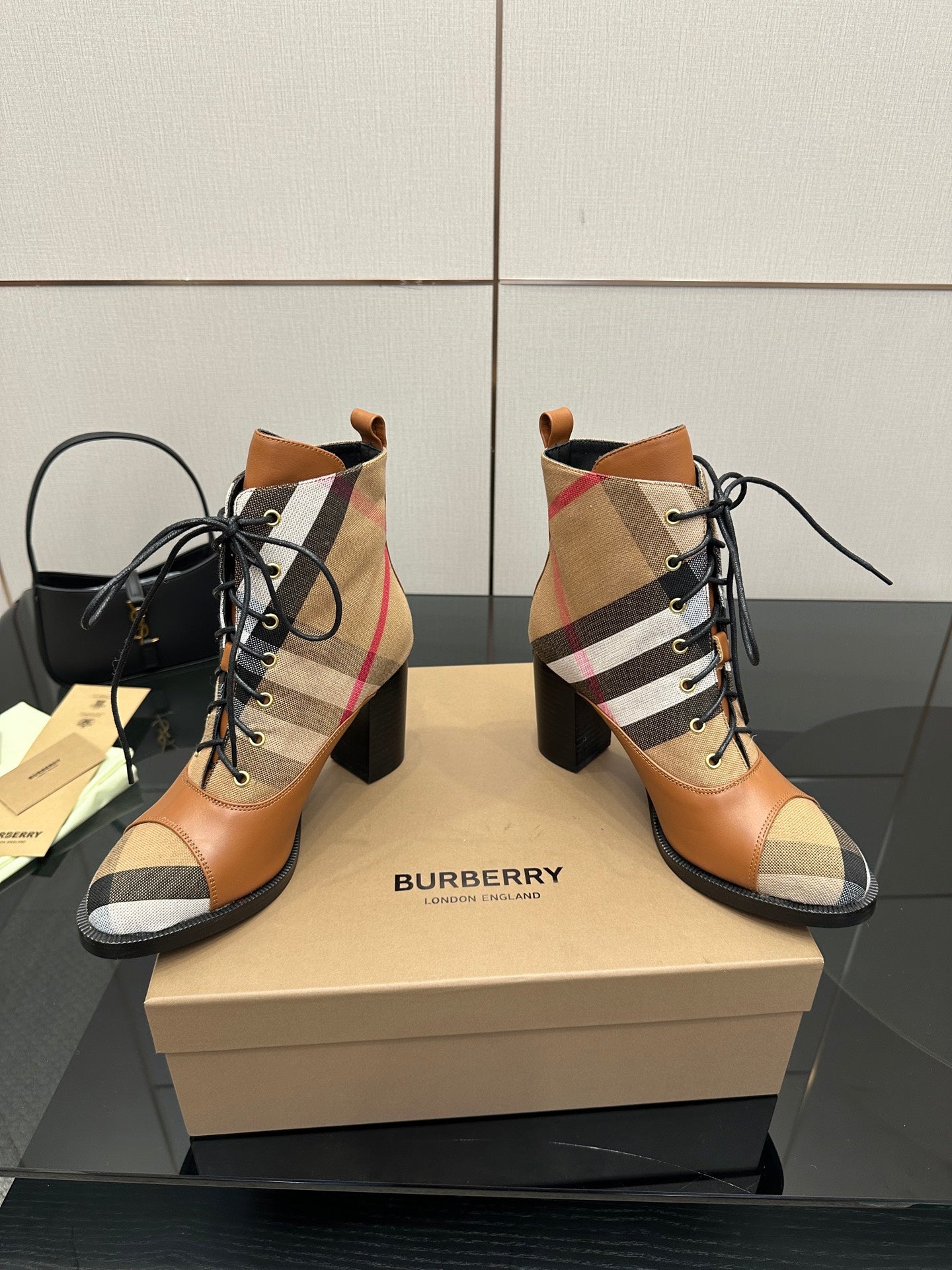 Pair of tan check lace-up ankle boots with black laces and block heel