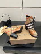 Tan and check lace-up ankle boots with black heel and rounded toe