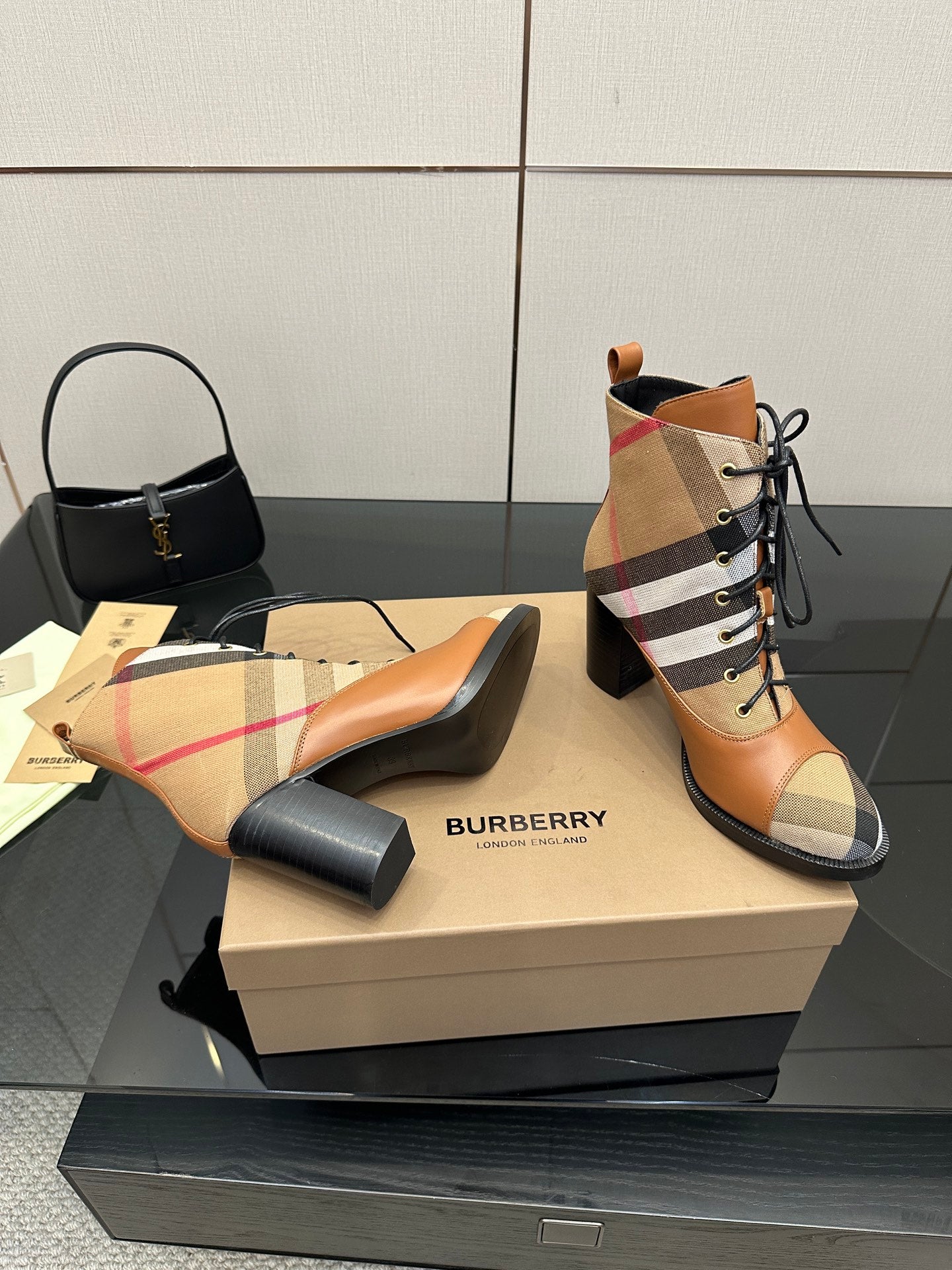 Tan and check lace-up ankle boots with black heel and rounded toe