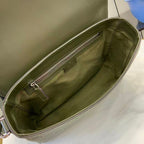 Gucci bag interior view with zippered pocket and green fabric lining