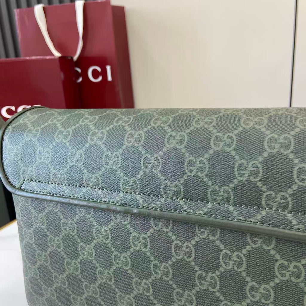Gucci GG monogram flap bag close-up of textured canvas and stitched edge
