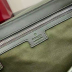 Gucci logo patch on green zip pocket with silver zipper and stitched border