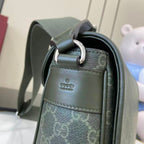 Gucci bag top corner with ring hardware, green leather trim, and GG canvas