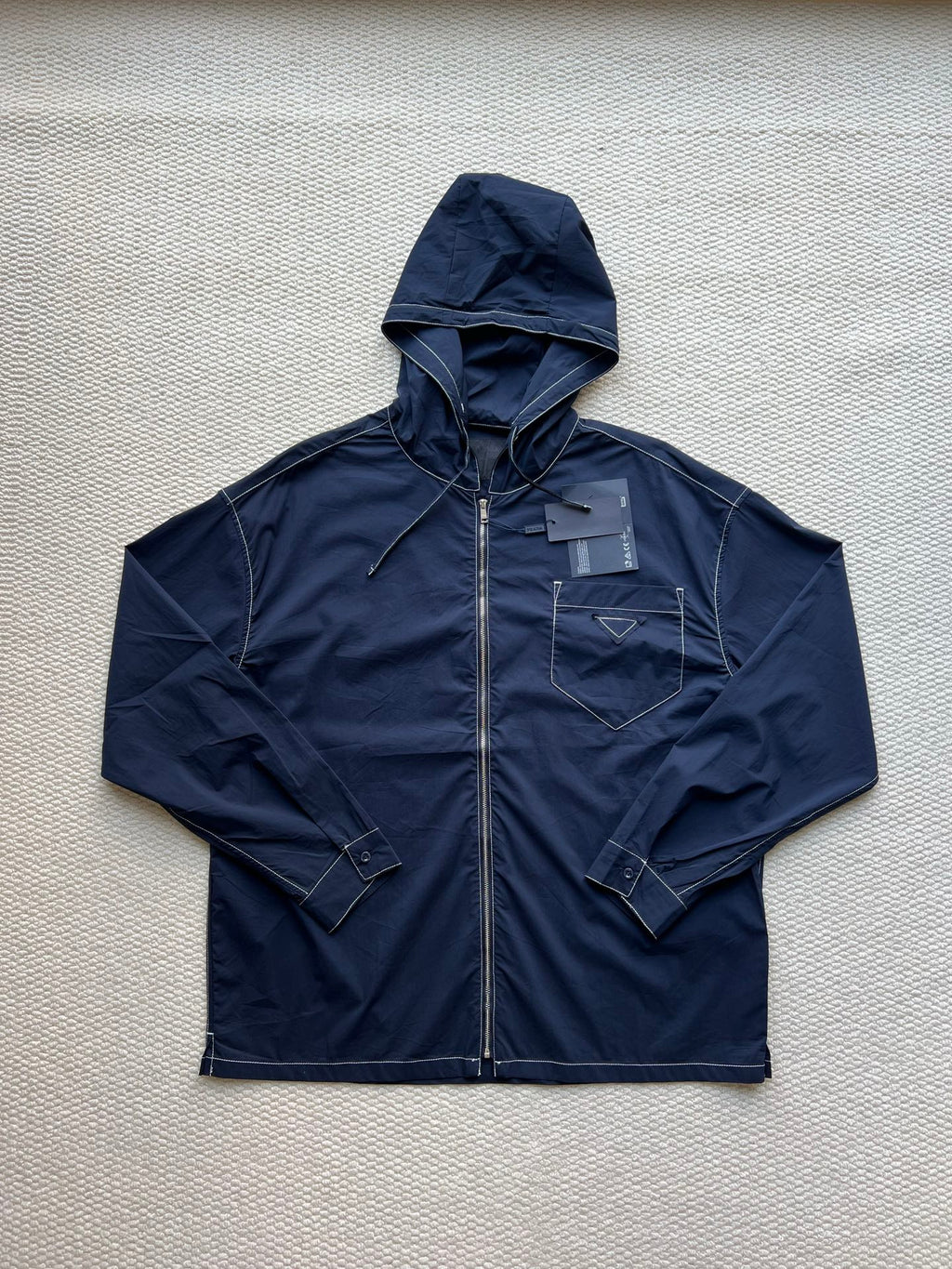 Men's navy hooded zip jacket with adjustable drawstring