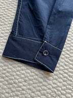 Men's navy jacket with cuff seam and round snap button tab