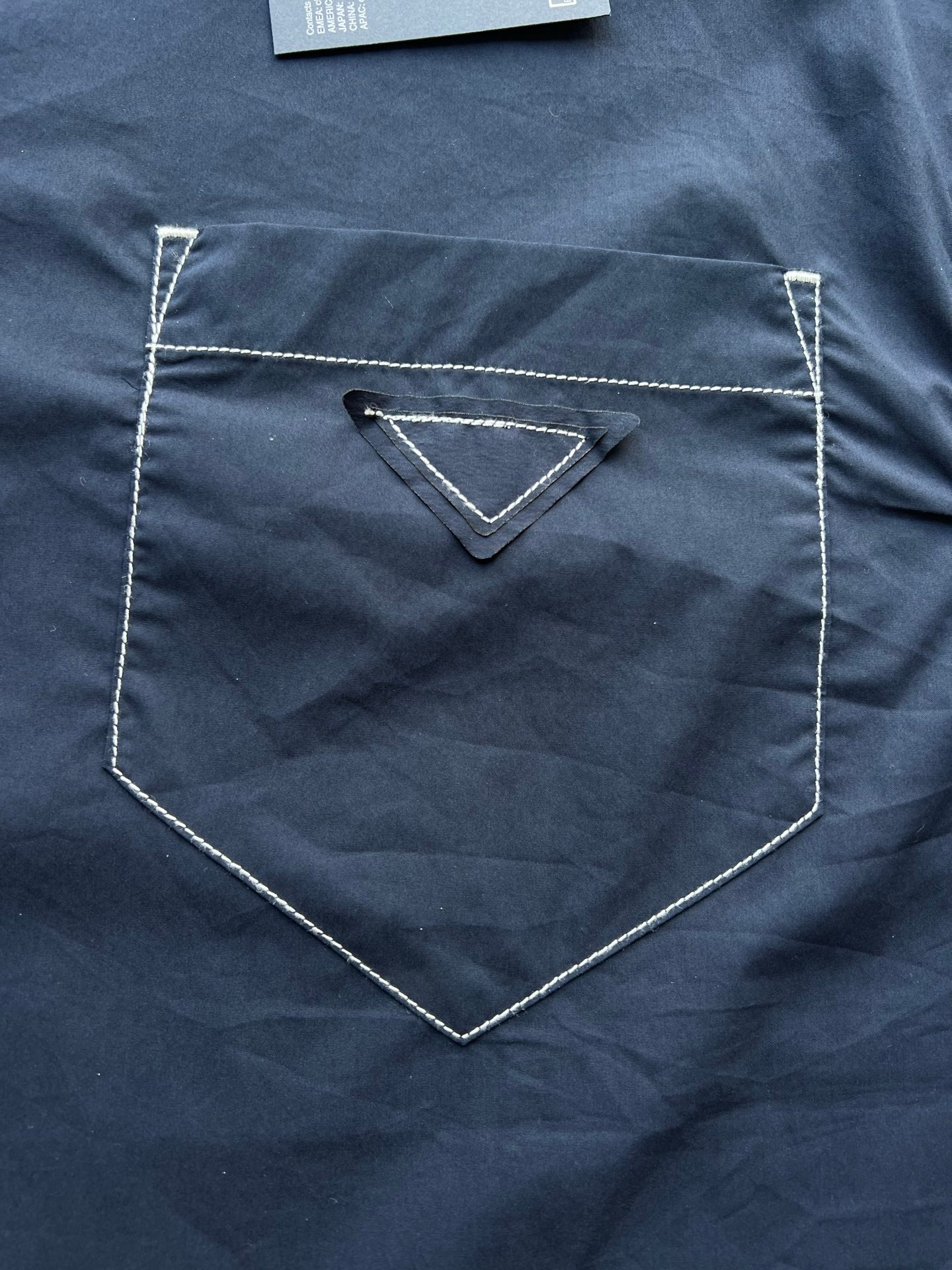 Men's navy jacket with triangular chest logo pocket detail