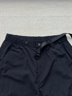 Stone Island cargo pants in dark navy with button front, belt loops, and drawstring