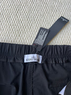 Stone Island cargo pants in dark navy with waistband logo patch and size label