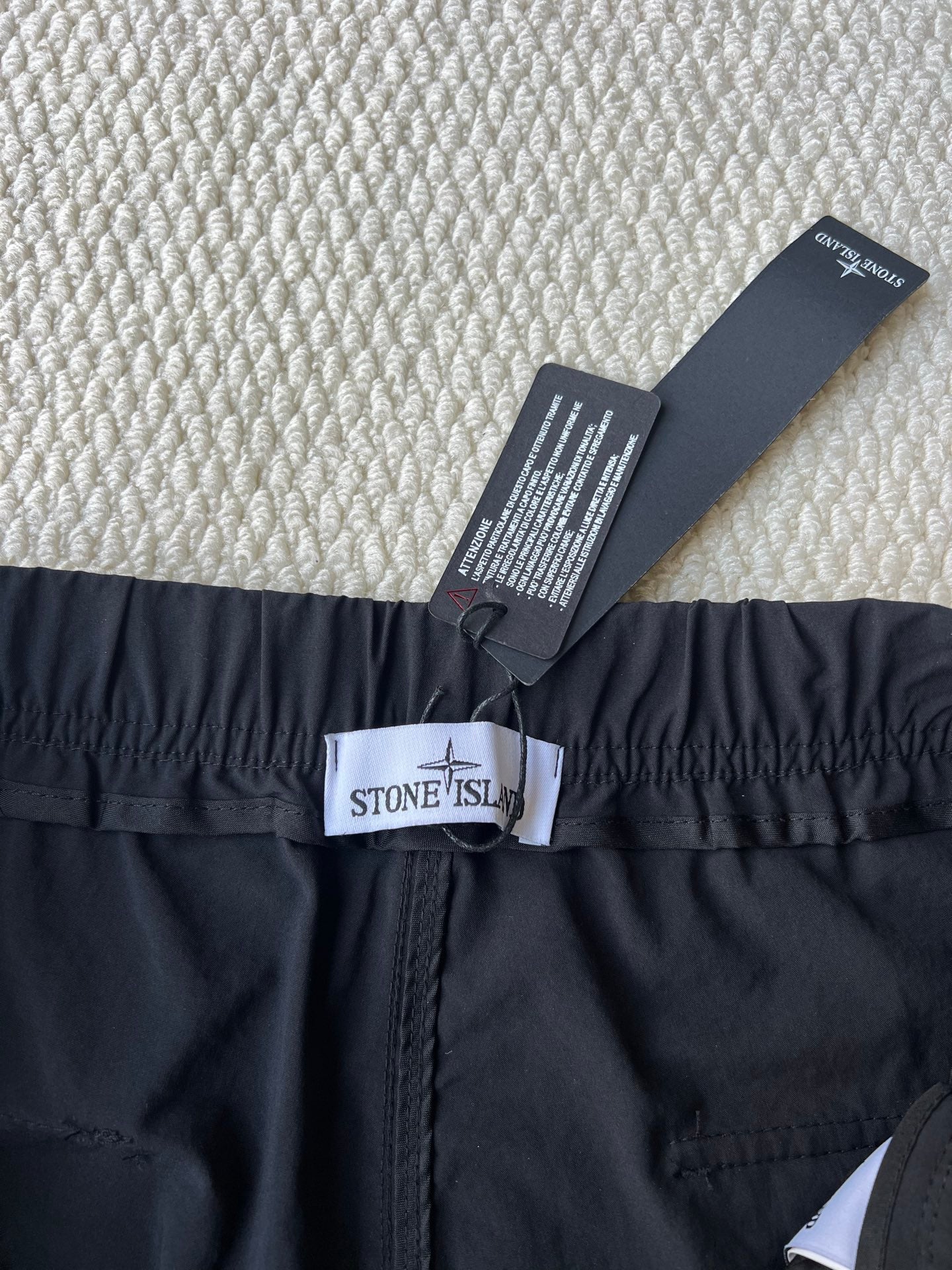 Stone Island cargo pants in dark navy with waistband logo patch and size label