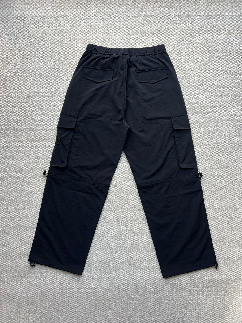 Stone Island cargo pants in dark navy with flap cargo pockets and drawstring waist