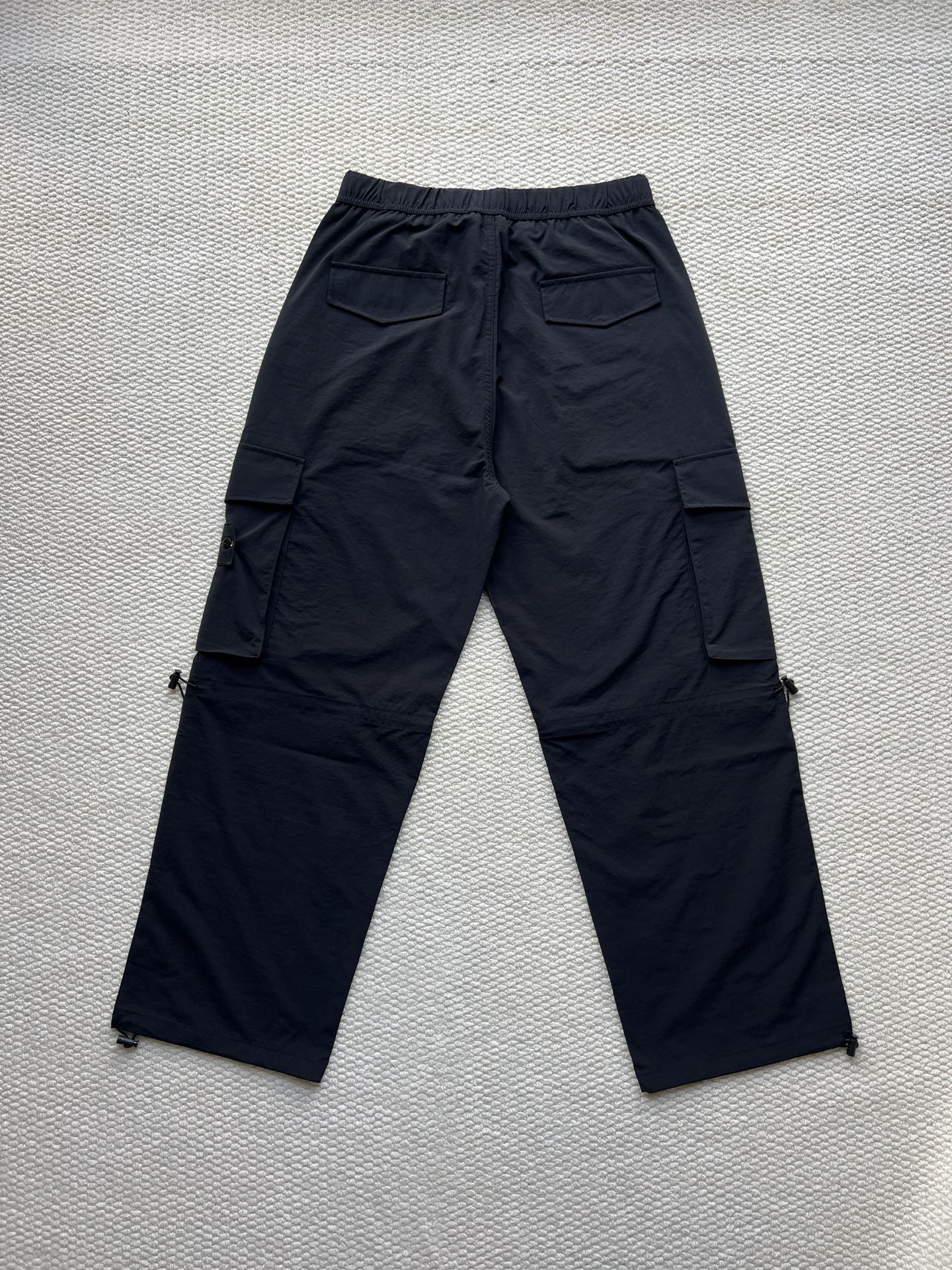 Stone Island cargo pants in dark navy with flap cargo pockets and drawstring waist