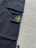 Stone Island cargo pants in dark navy with green logo patch on side pocket