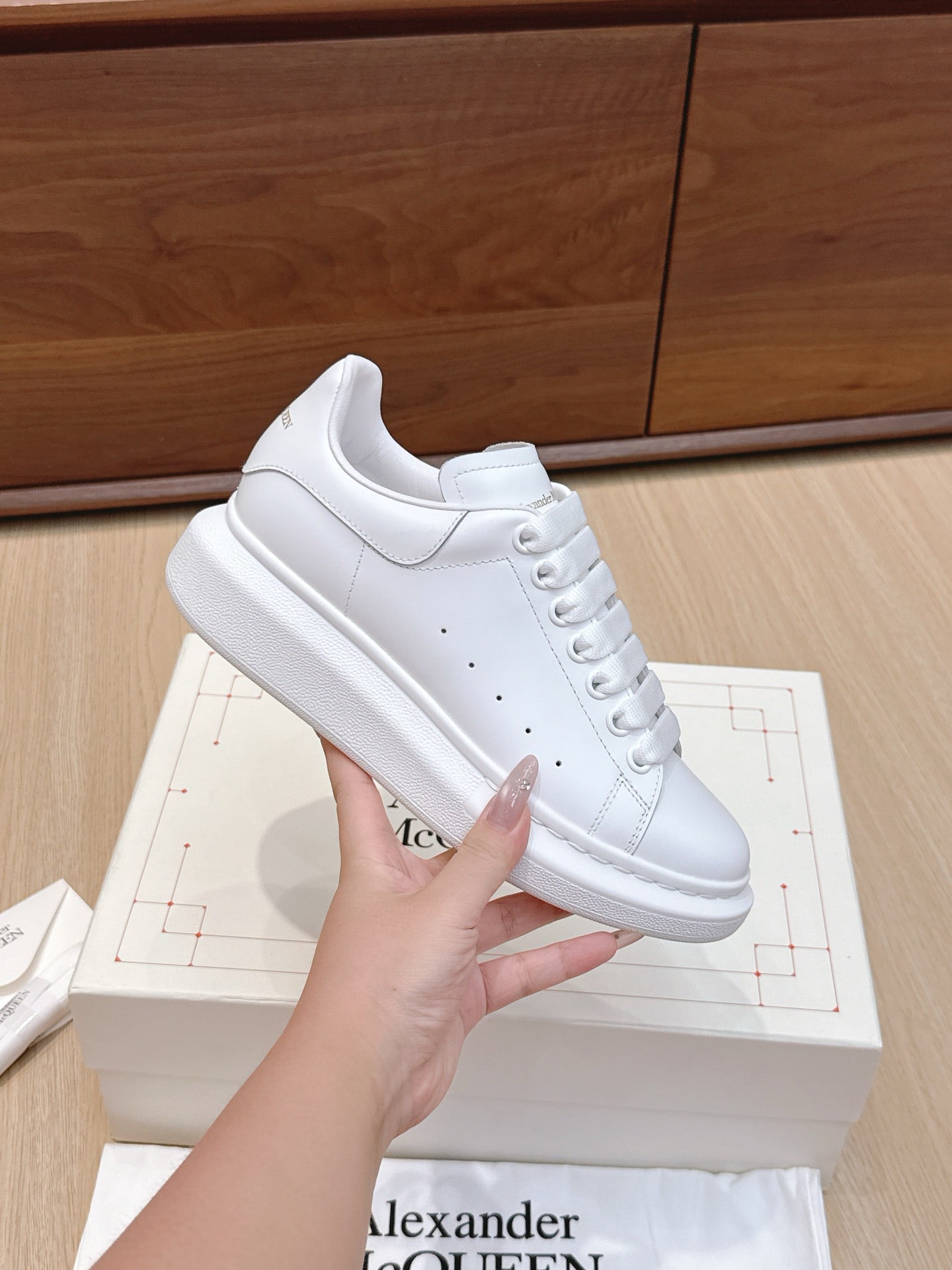 Alexander McQueen white leather low-top sneakers, lace-up with perforated toe details