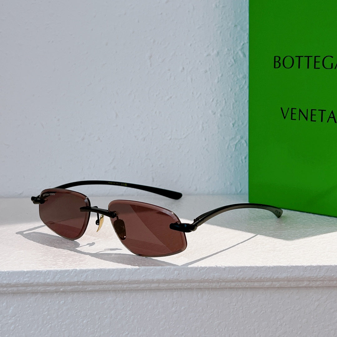 Bottega Veneta sunglasses with black frame and dark tinted lenses, side view