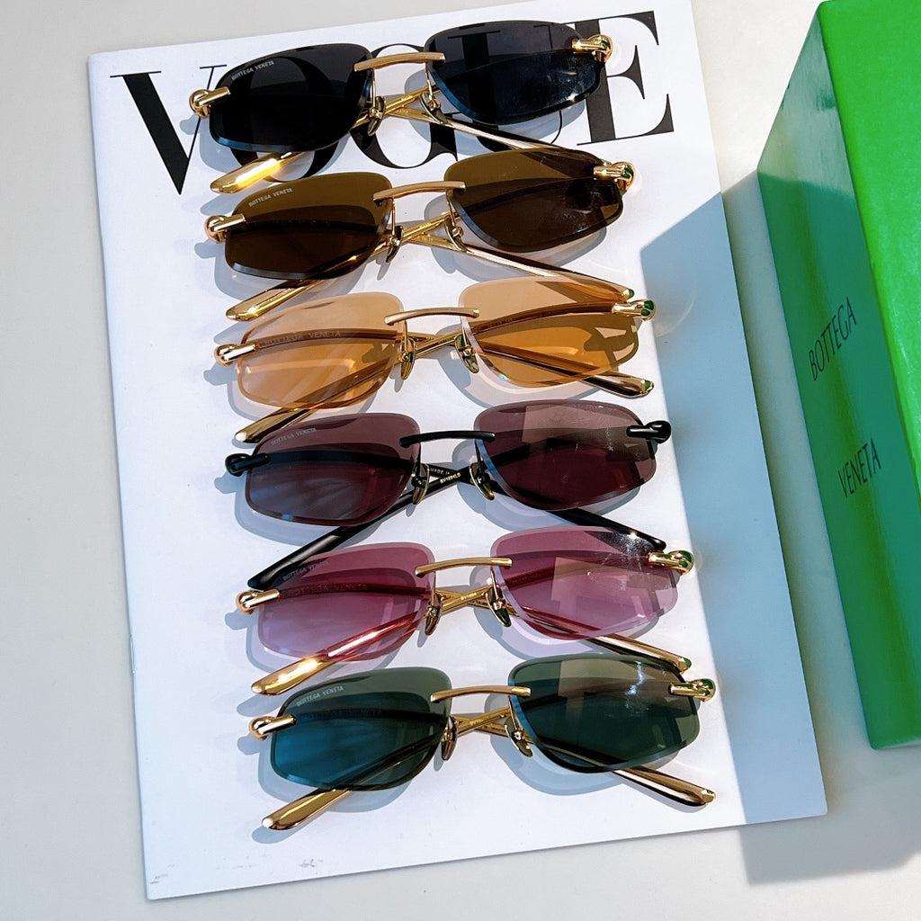 Bottega Veneta sunglasses assortment with tinted lenses and gold frames on cards
