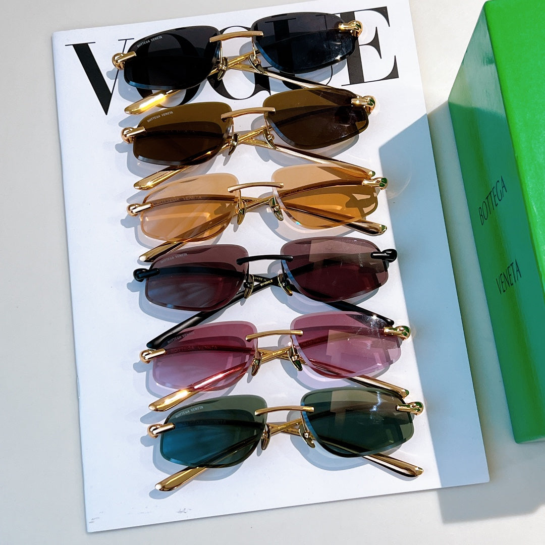 Bottega Veneta sunglasses assortment with tinted lenses and gold frames on cards