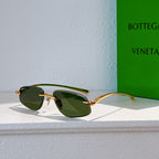 Bottega Veneta sunglasses with gold frame and green tinted lenses, side view