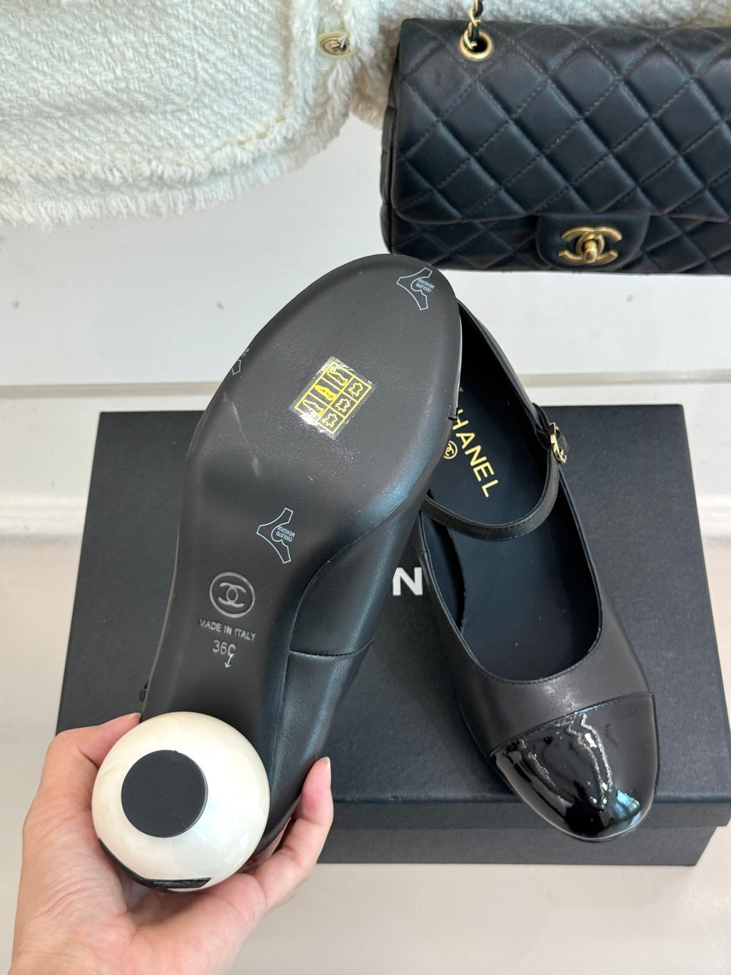 Black Mary Jane pump with silver patent toe and round white heel cap
