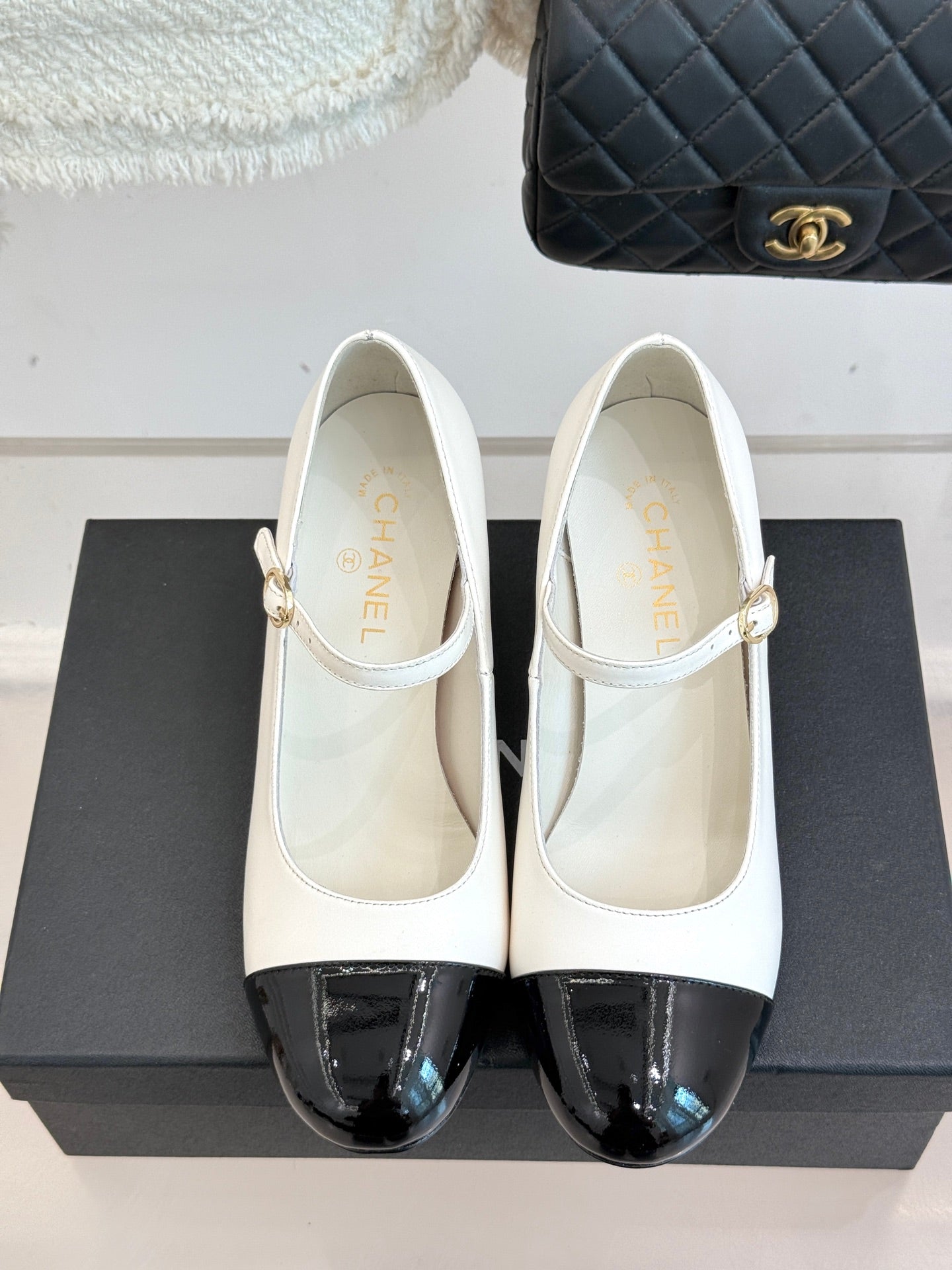 Chanel women's Mary Jane flats, white with black patent toe and ankle strap