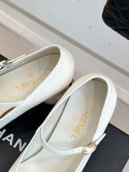 Chanel women's white flats with gold-tone buckle strap and logo lining