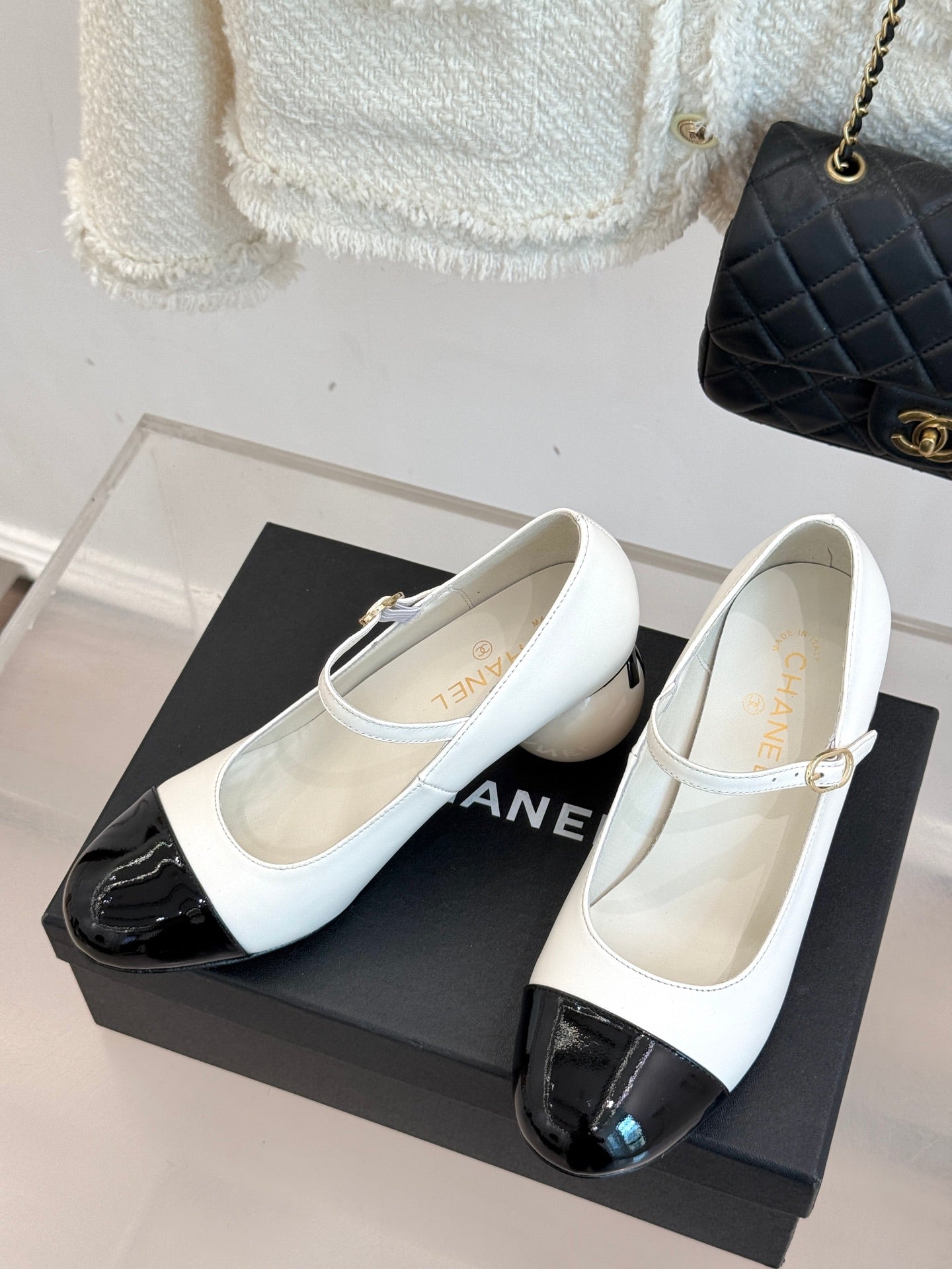 Chanel women's Mary Jane flats, white leather with black glossy toe panels