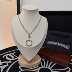 Silver-tone chain necklace with round ring pendant on a display stand.