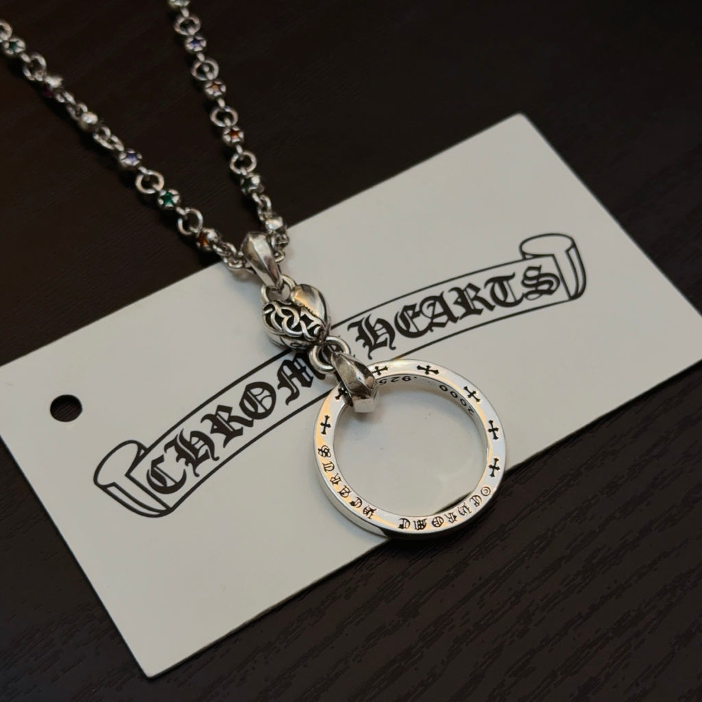 Silver-tone circular ring pendant necklace on a card, with chain and clasp visible.