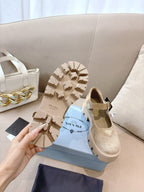 Prada ladies suede shoes outsole view, beige with deep tread and lug pattern