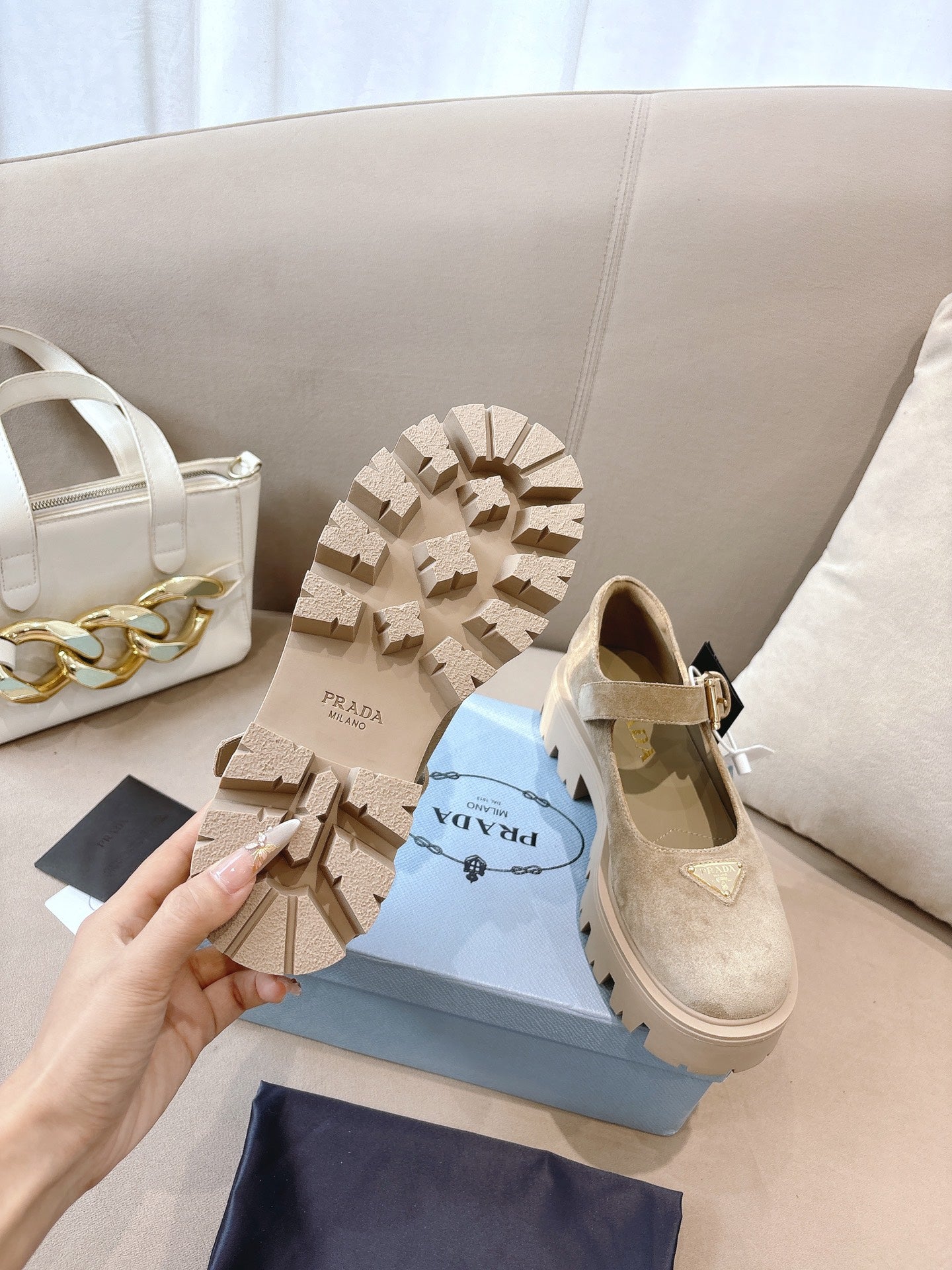 Prada ladies suede shoes outsole view, beige with deep tread and lug pattern