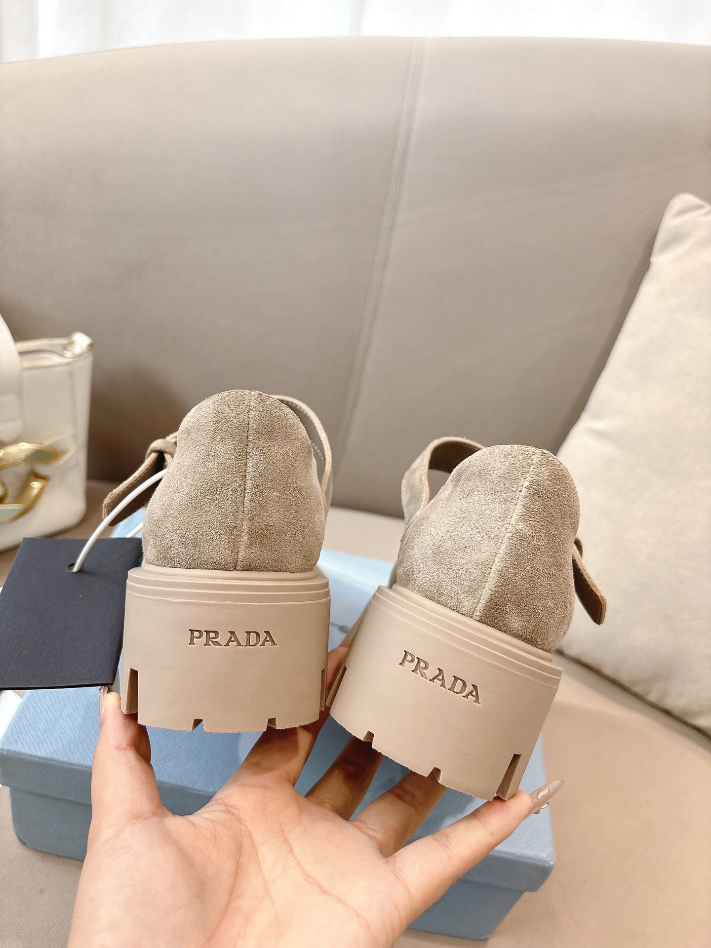 Prada ladies suede shoes, beige back view with PRADA heel tab and lug sole