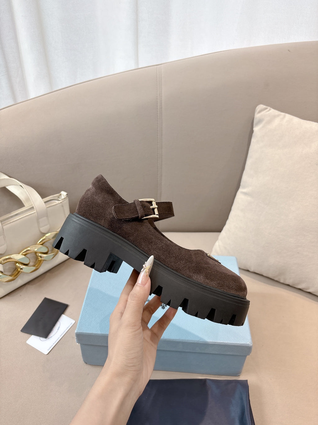 Prada women’s suede slip-on style shoes with buckle, brown, thick lug sole.