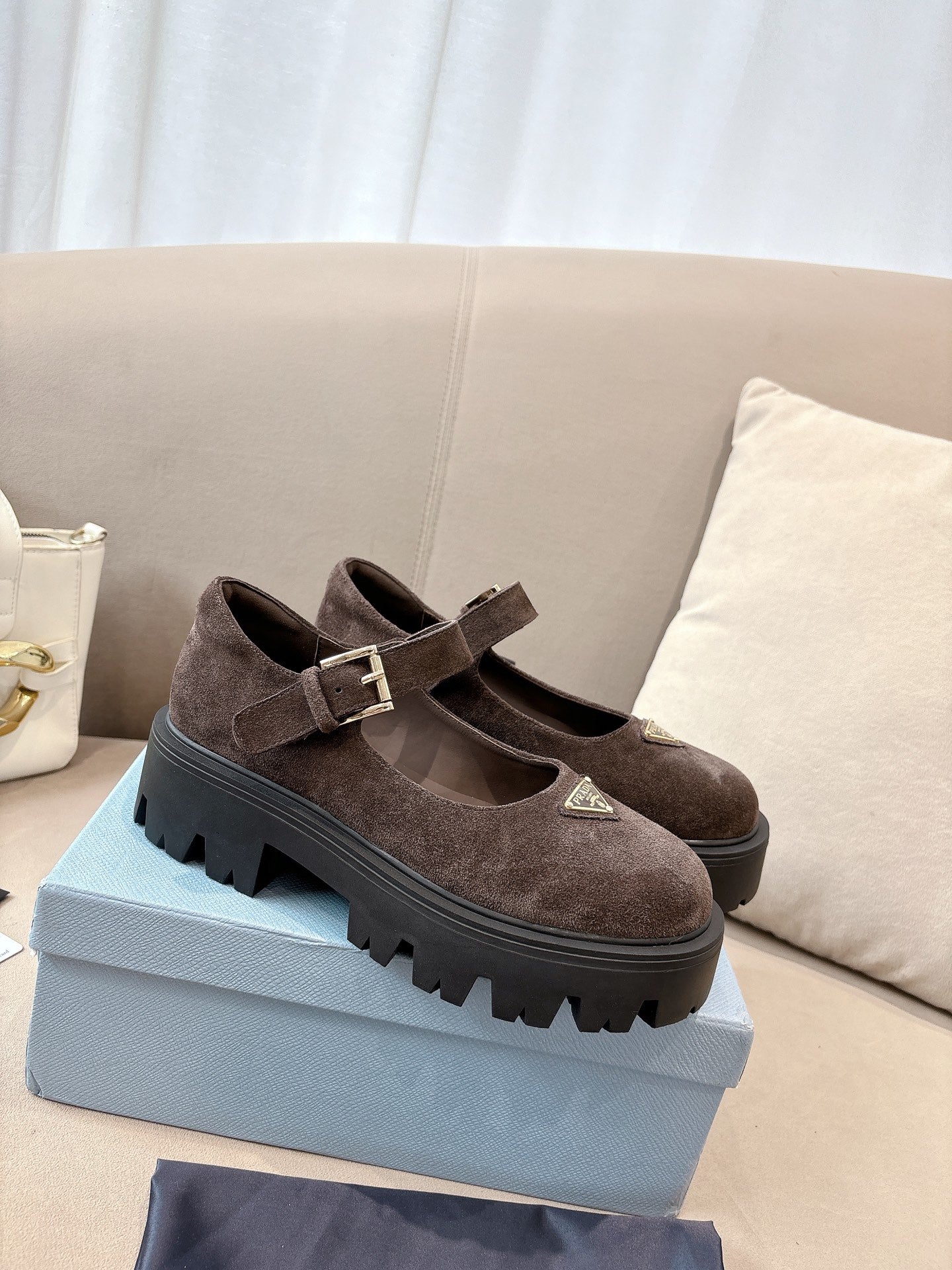Prada women’s suede mary jane shoes with buckle strap, brown, lug sole.