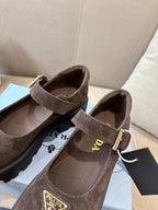 Prada women’s suede buckle flats, brown, view of interior lining and strap.