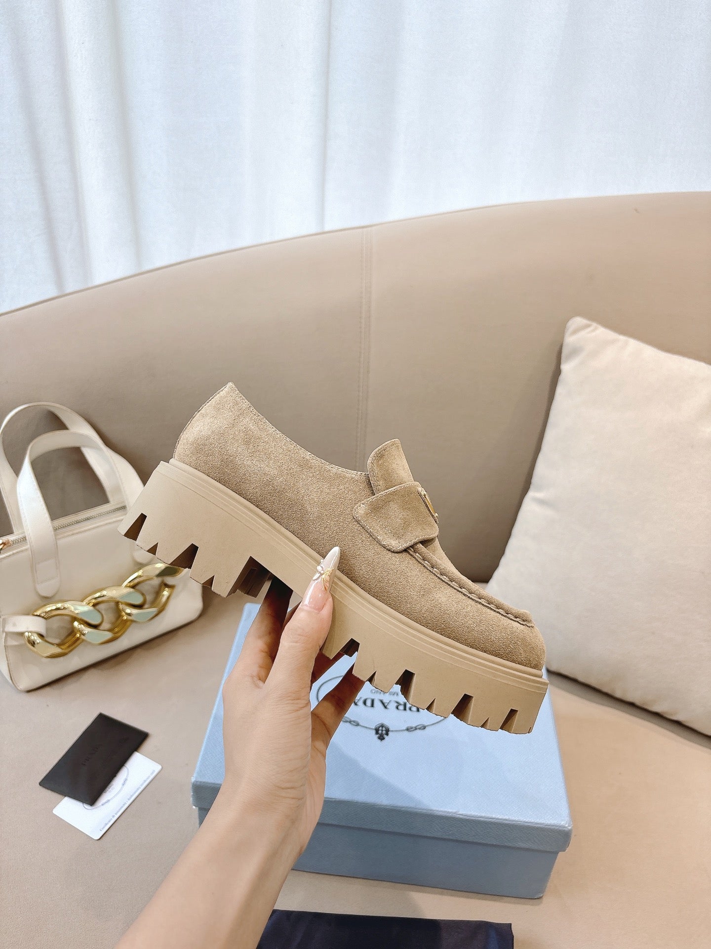 Beige suede loafer mule with strap, chunky tread sole edge, Prada